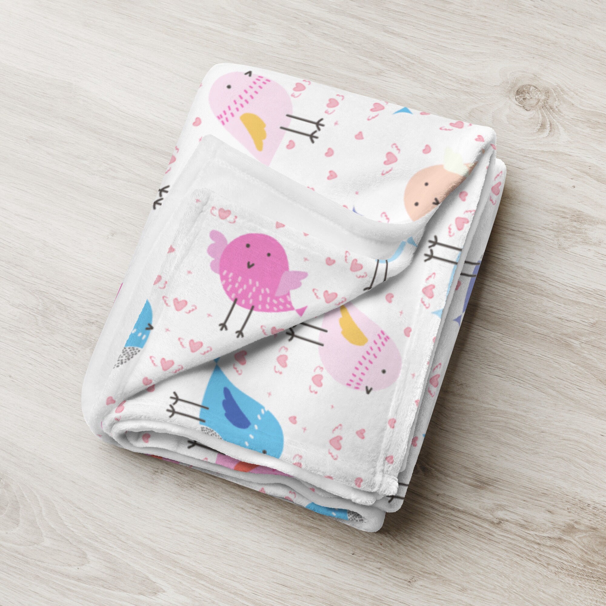 Girls colorful birds blanket soft white material with playful pink blue and peach cartoon bird and heart pattern
