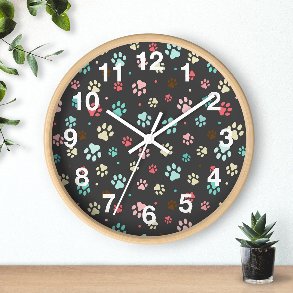 Kids colorful paw print silent wood wall clock with light wood frame black face and pink teal beige paw prints