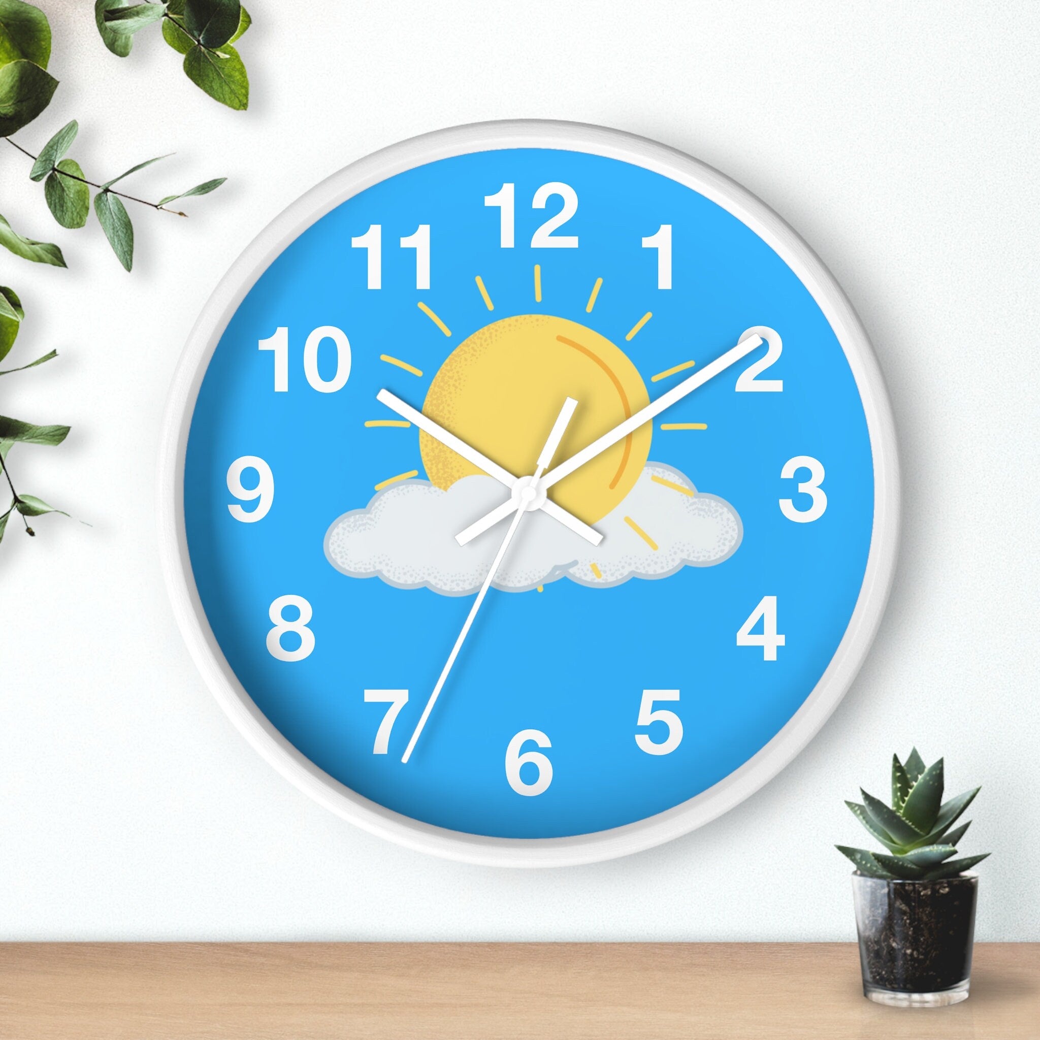 Partly sunny blue skies silent wood wall clock with bright blue face yellow sun white cloud and simple white frame