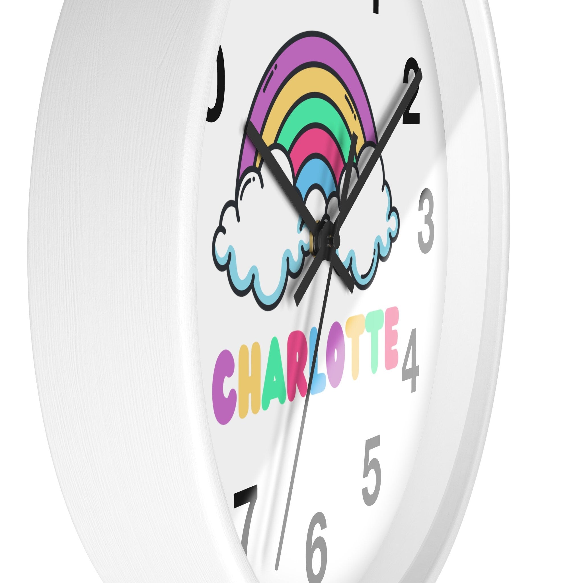White round silent wood wall clock for girls with a colorful rainbow cloud design and multicolored name charlotte