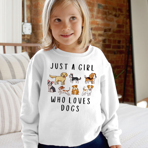 White long-sleeved cozy sweatshirt for girls with cartoon dogs graphic and just a girl who loves dogs text