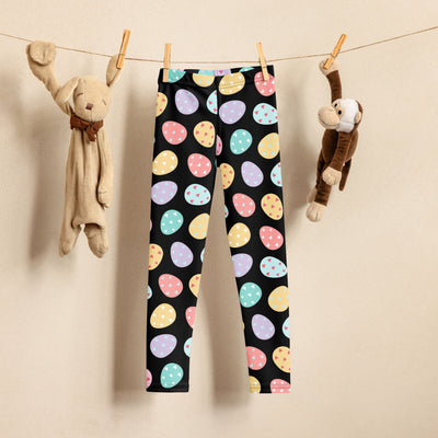 Black kids buttery soft leggings with playful pastel pink yellow blue and green easter egg pattern