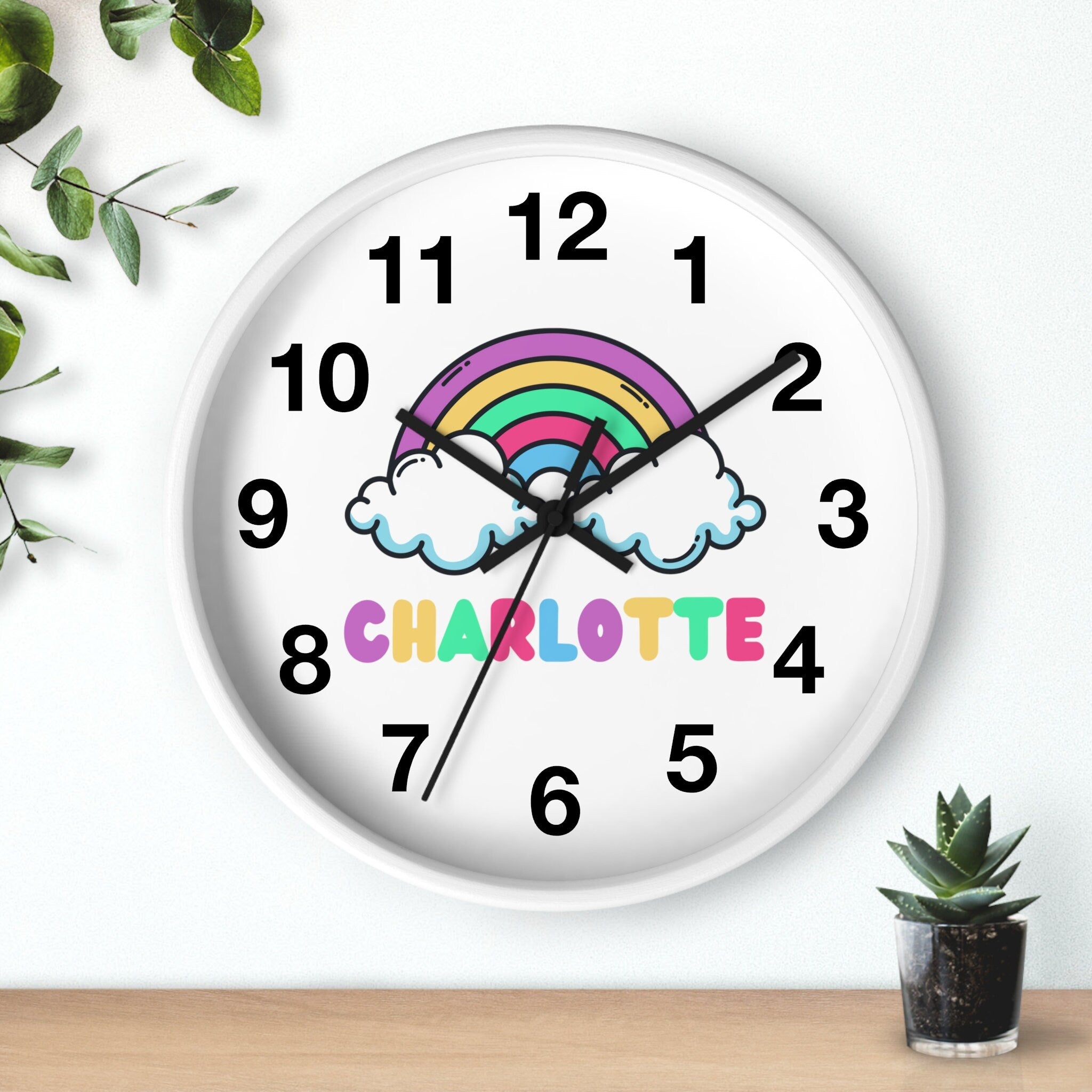 White round silent wood wall clock with colorful rainbow cloud design and custom name charlotte for girls room decor