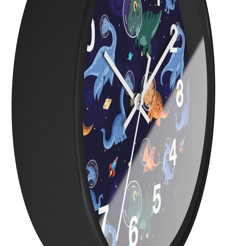 Black-framed silent wood wall clock with vibrant space-themed face featuring cartoon dinosaurs in astronaut suits