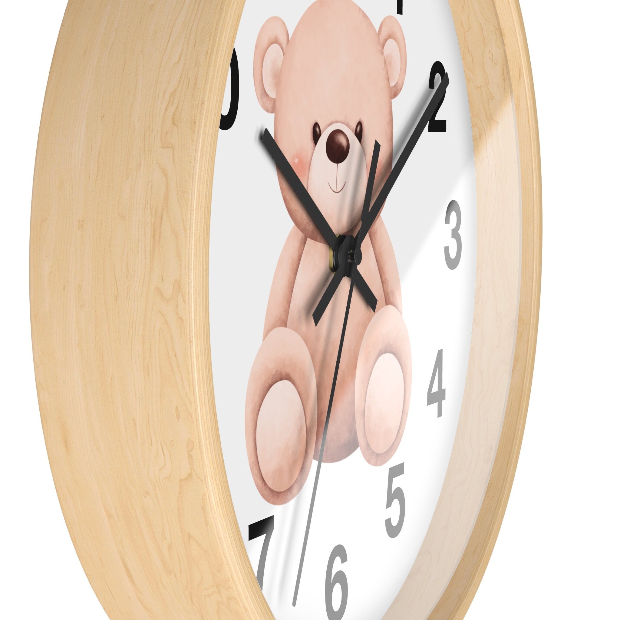 Kids teddy bear silent wood wall clock with a light wood frame and white face featuring a beige teddy bear illustration