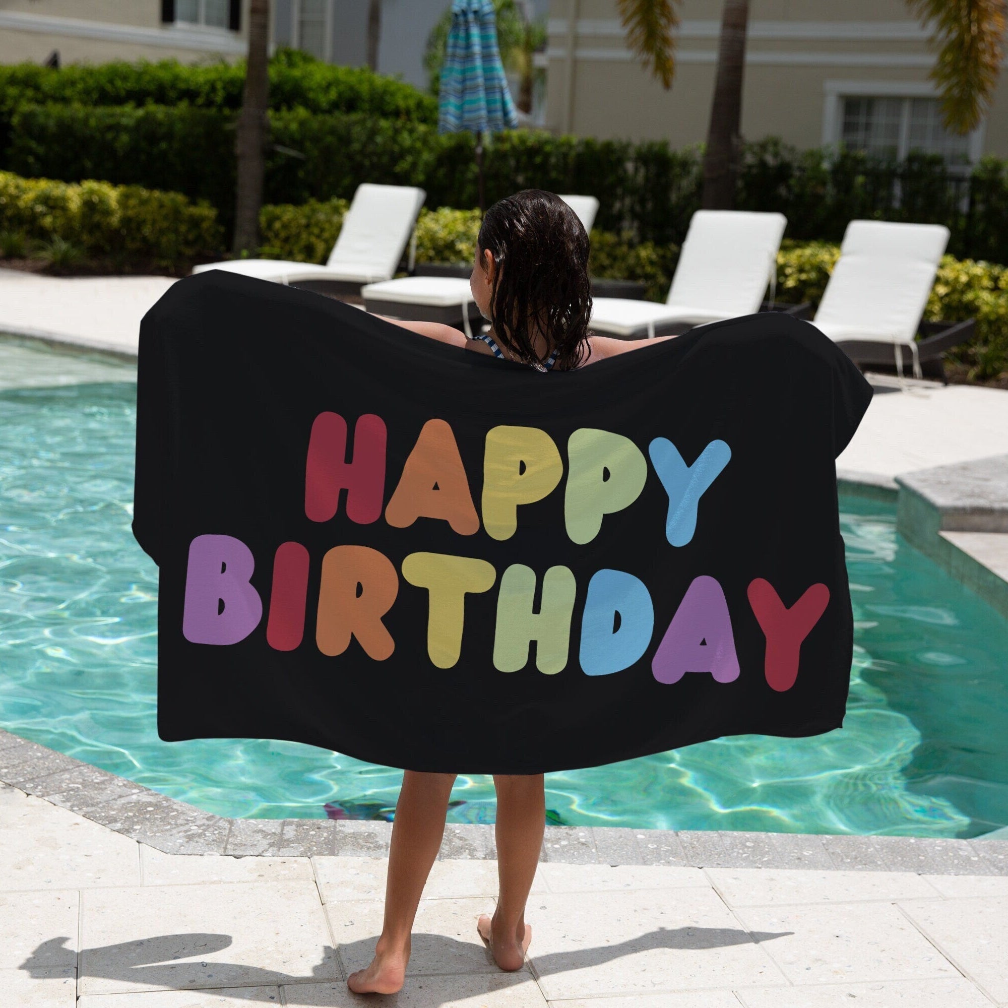 Black girls happy birthday beach towel with rainbow-colored lettering perfect for birthday celebrations
