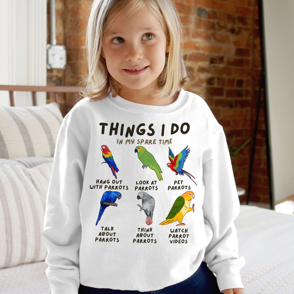 White kids long-sleeved sweatshirt with colorful parrot illustrations and text things i do in my spare time