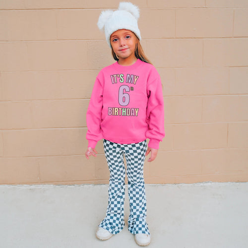 Girls custom age neon pink long-sleeved sweatshirt with its my 6th birthday multicolored print on front for birthdays