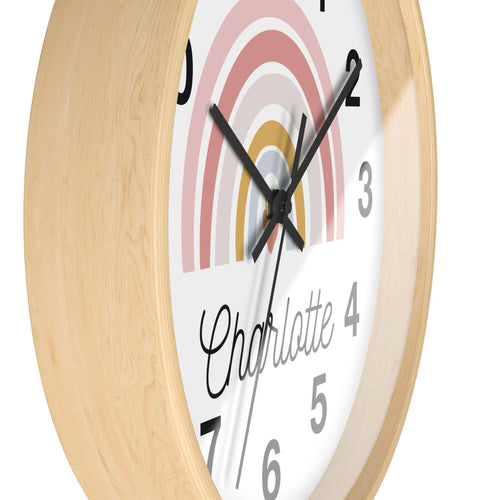 Girls custom name rainbow heart silent wood wall clock with a round wooden frame and pastel rainbow design featuring name charlotte 4