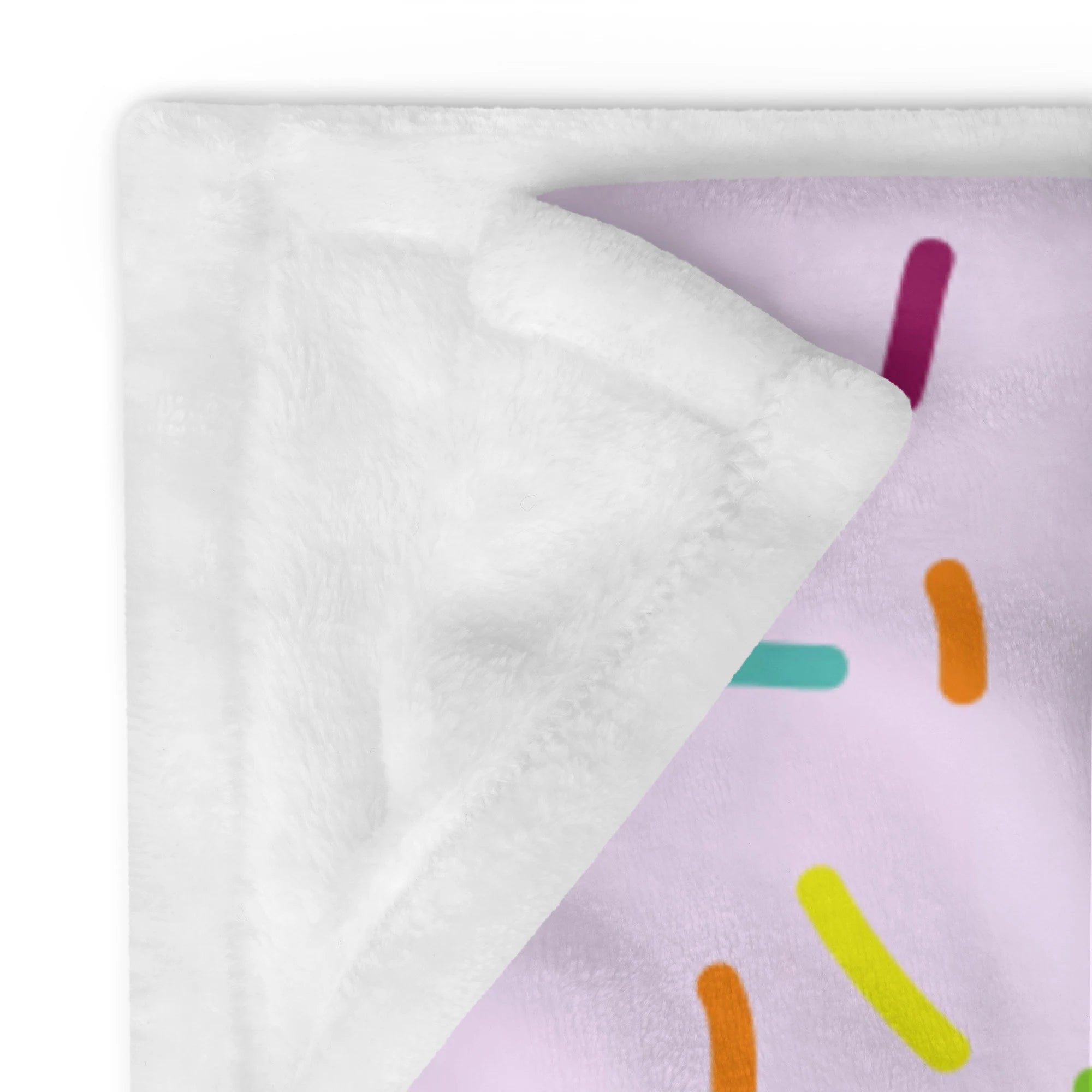 A plush lavender girls colorful sprinkles ice cream blanket with soft white fleece interior and candy sprinkle design