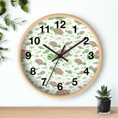Kids green sea turtles silent wood wall clock with a light wood frame and white face featuring green and brown turtles