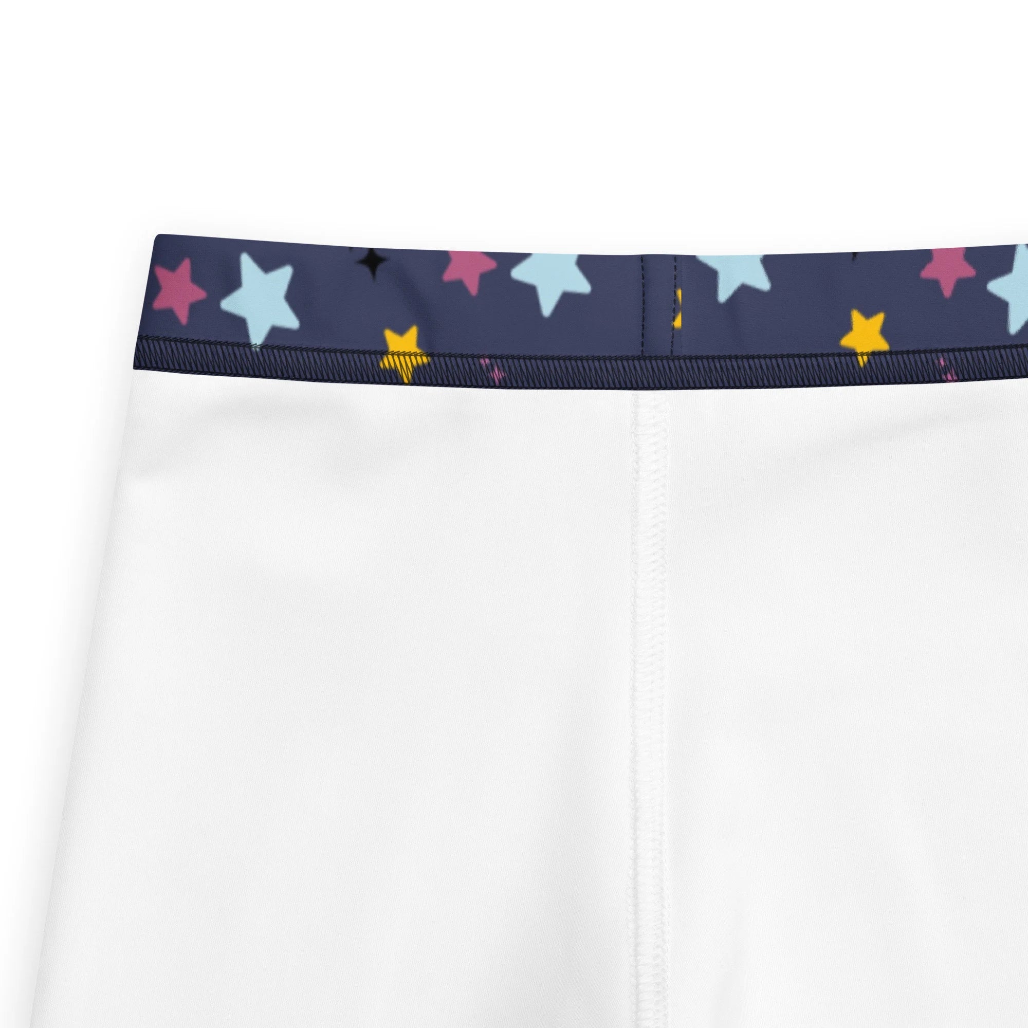 White kids night stars buttery soft athletic shorts with navy waistband and colorful star patterns in pink blue yellow