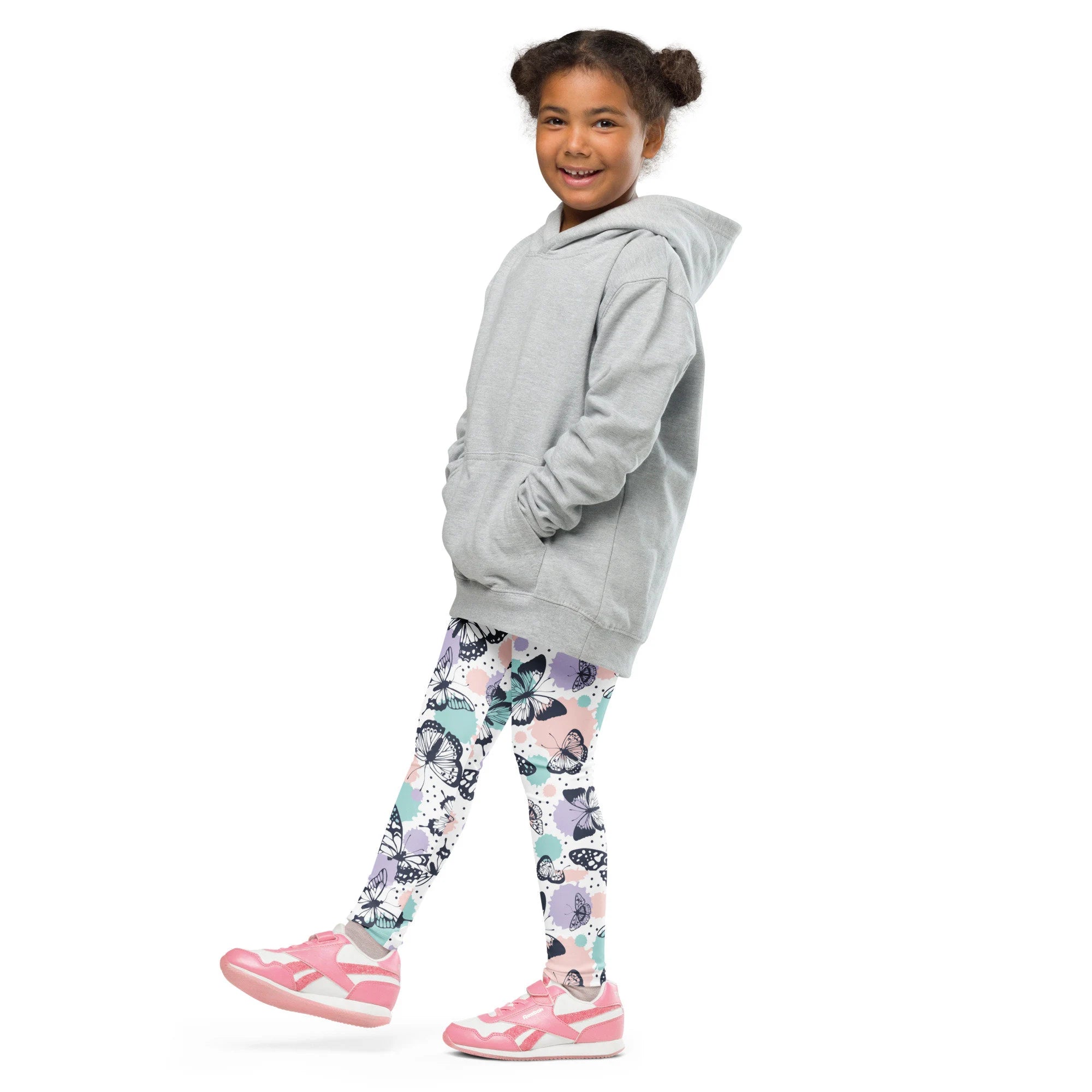 Gray hooded sweatshirt with front pockets and relaxed fit paired with girls butterfly buttery soft leggings