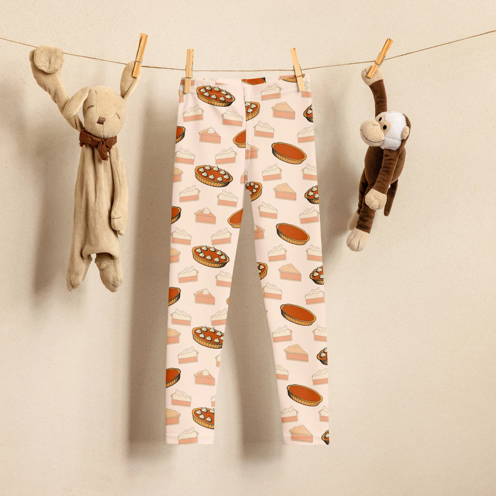 Kids pumpkin pie leggings white with playful pattern of assorted pie slices in warm brown and orange tones