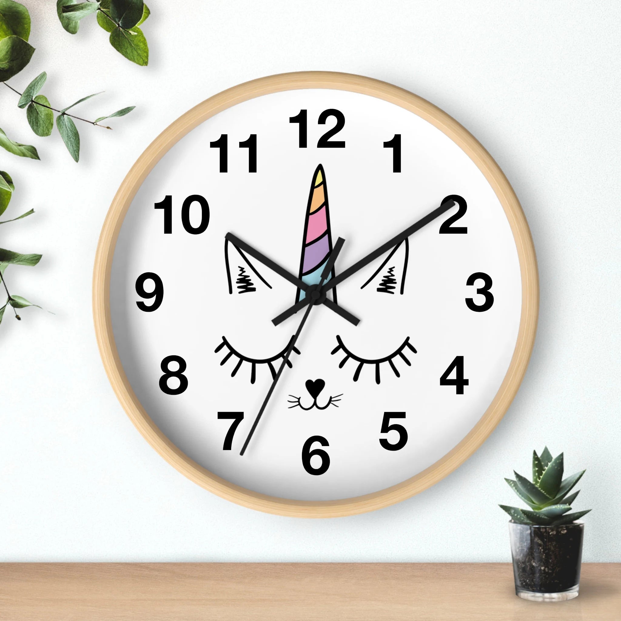 Girls caticorn silent wood wall clock with light wood frame white face black cat design and rainbow unicorn horn at 12 o’clock