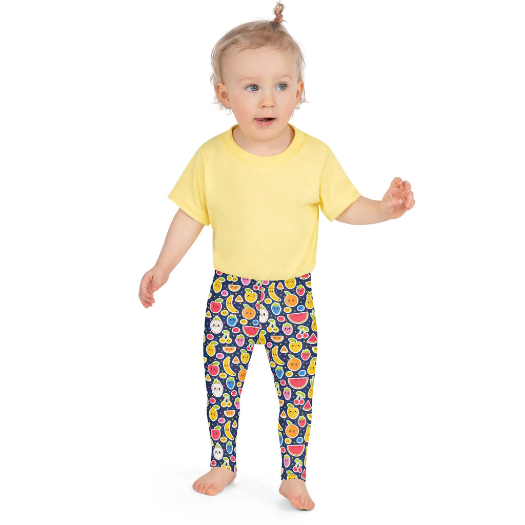 Toddler wearing a bright yellow short-sleeved t-shirt paired with girls emoji fruit buttery soft leggings