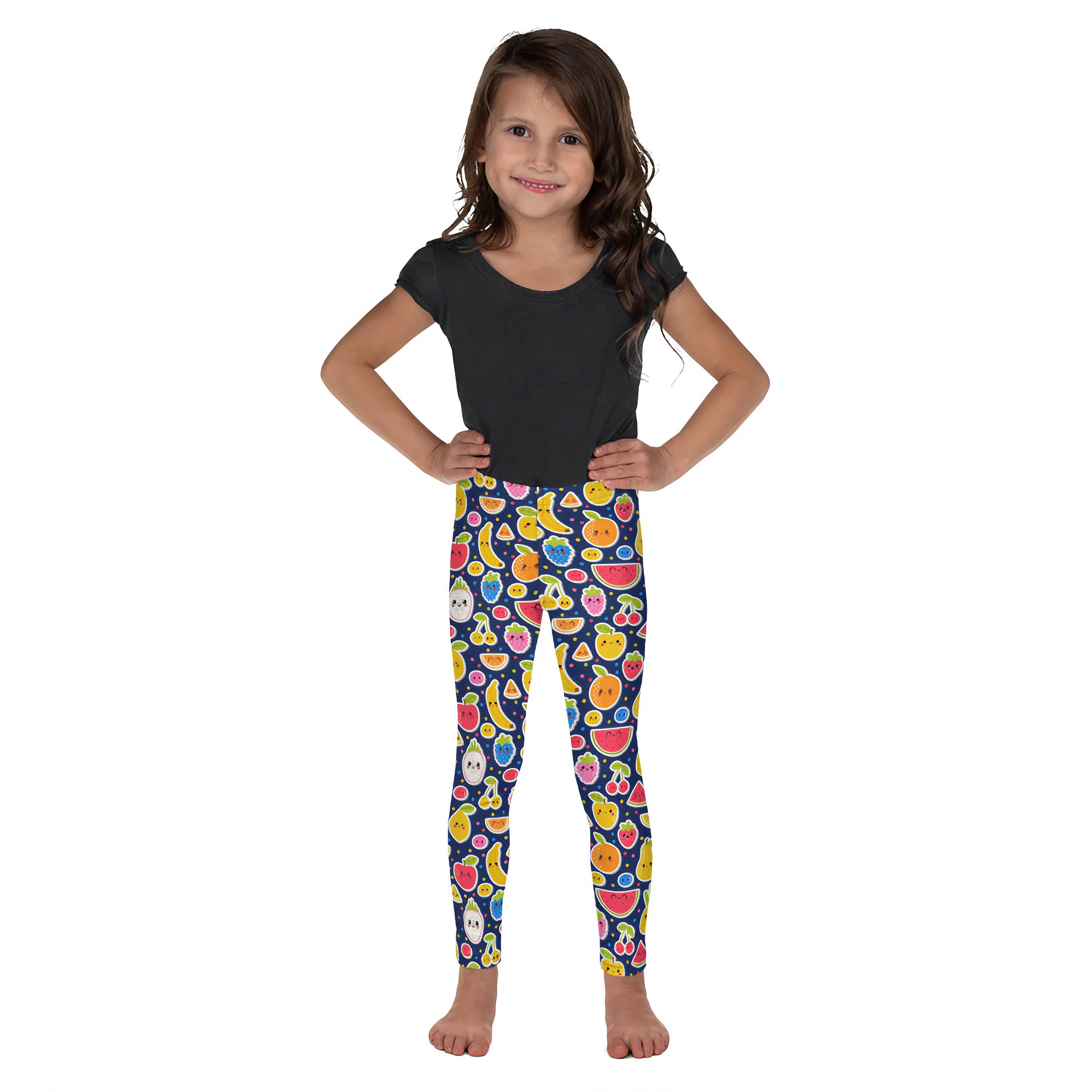 Girls emoji fruit buttery soft leggings featuring colorful fruit illustrations on a navy blue background