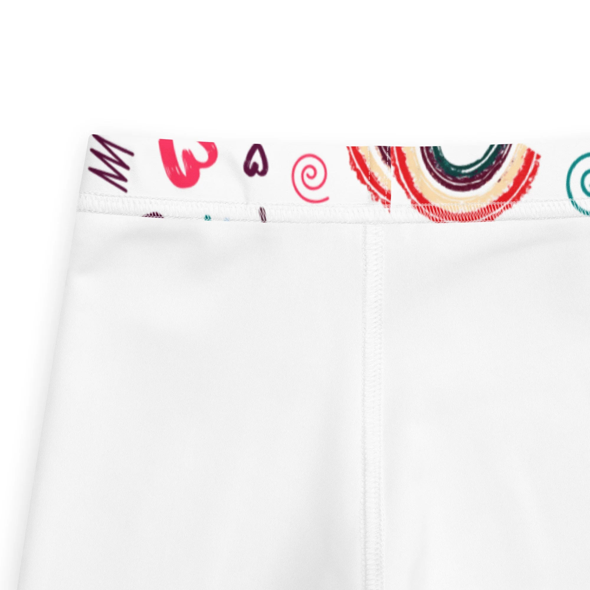 White girls leggings with colorful rainbow swirls and heart waistband perfect for playful everyday wear