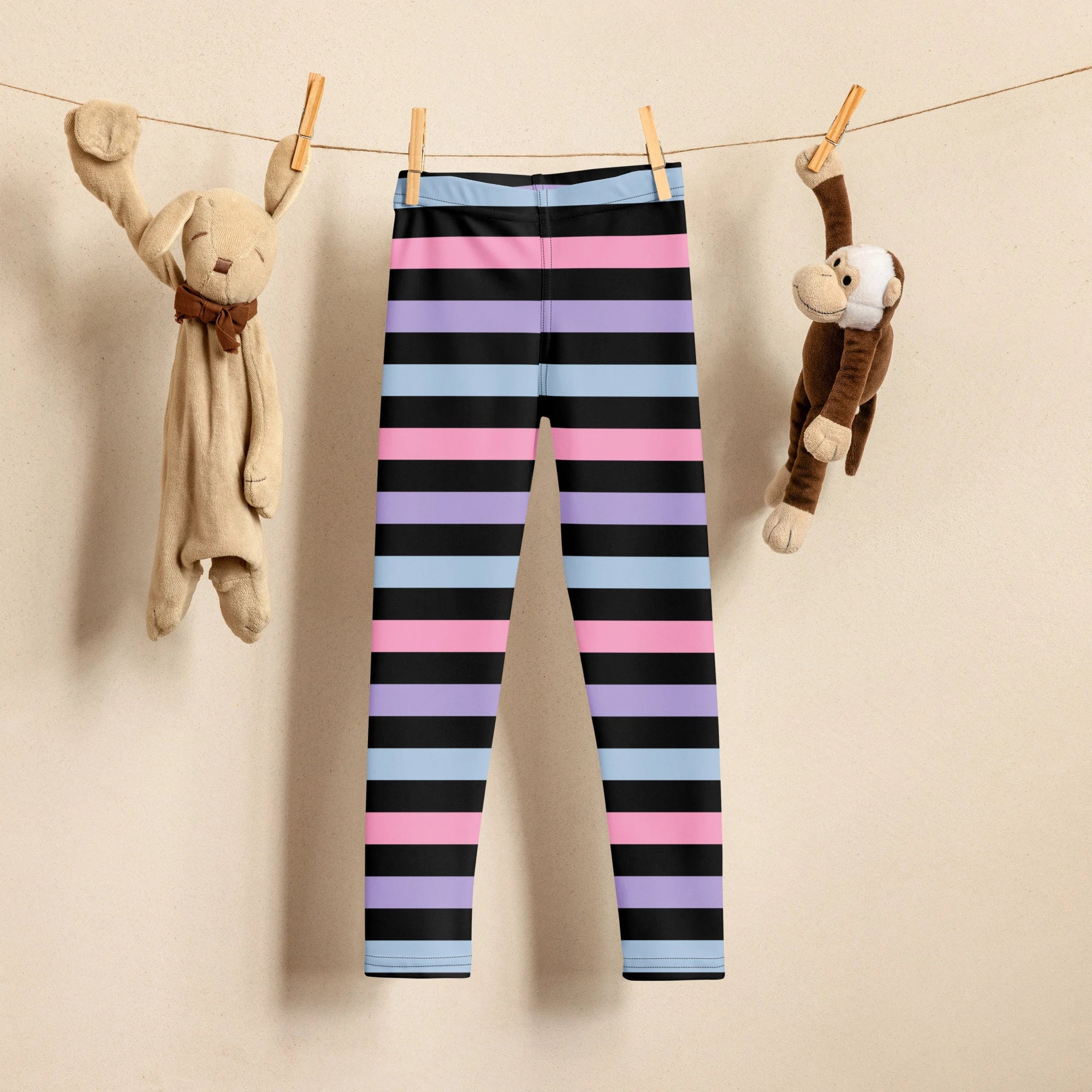 Girls colorful striped buttery soft leggings with purple black and blue horizontal bands for comfortable wear