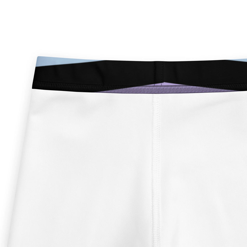 White athletic shorts with black and light blue elastic waistband paired with girls colorful striped buttery soft leggings purple black and blue