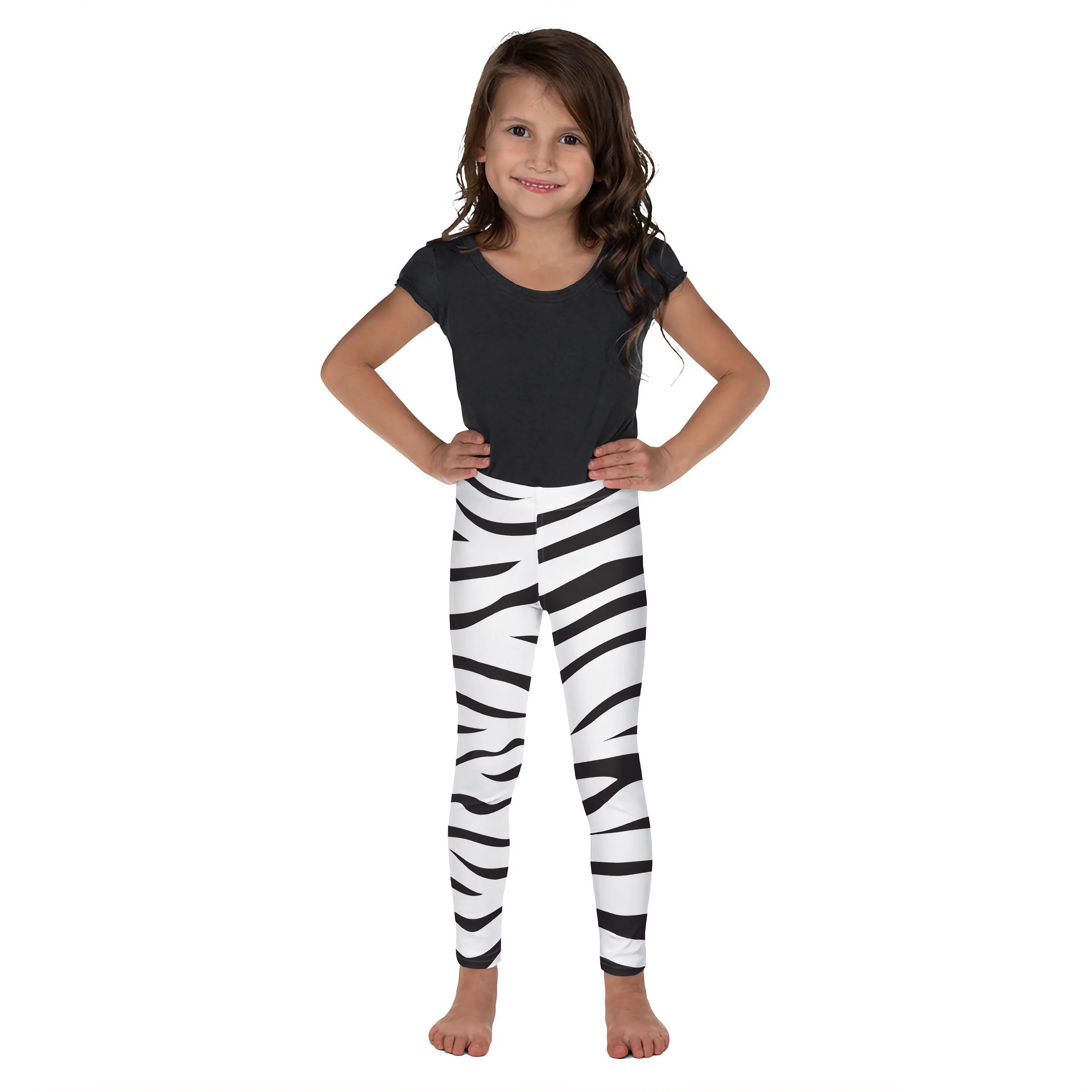 Kids striped zebra buttery soft leggings in black and white featuring a zebra stripe pattern and soft fabric