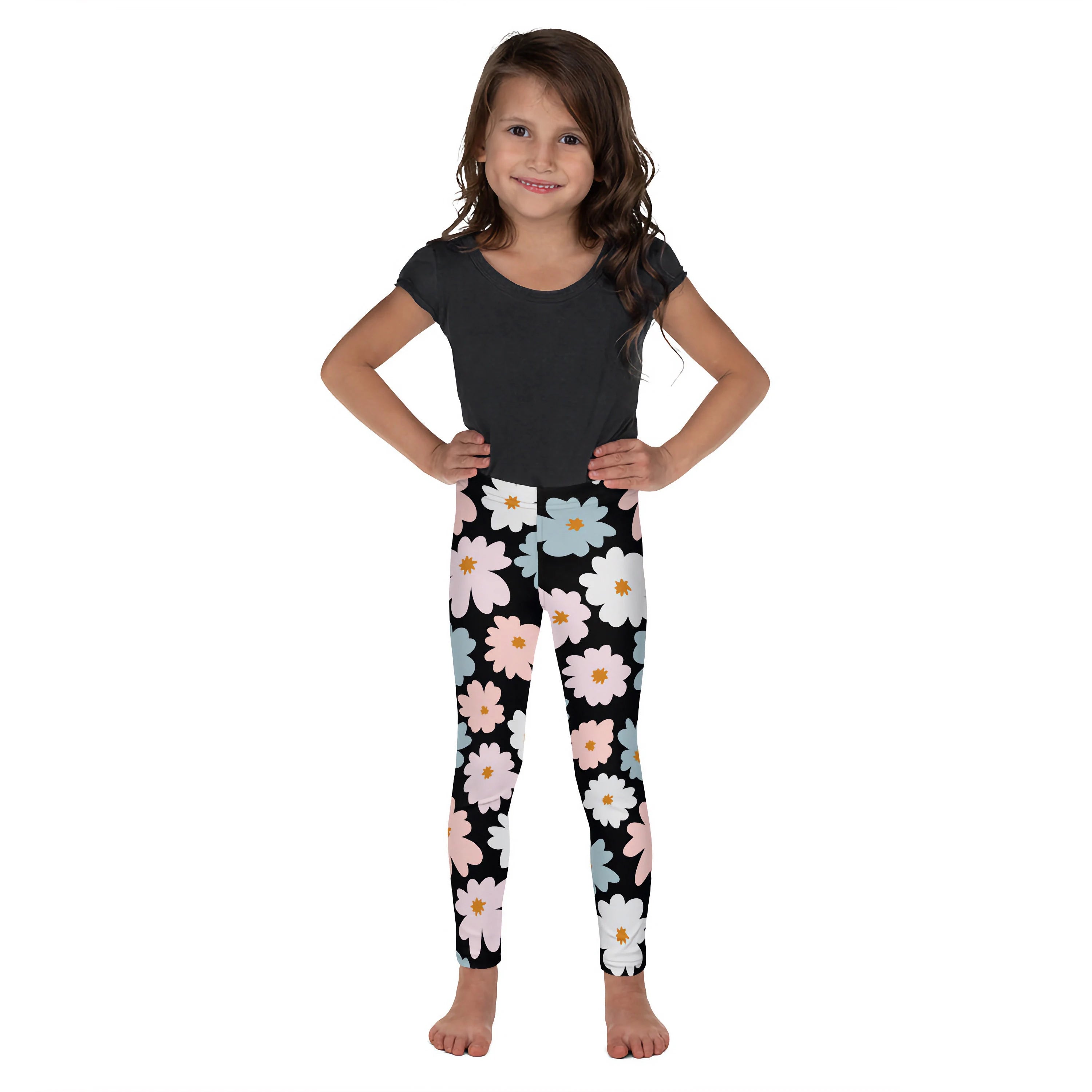 Girls flower buttery soft black leggings with a cheerful pastel pink white and light blue daisy pattern