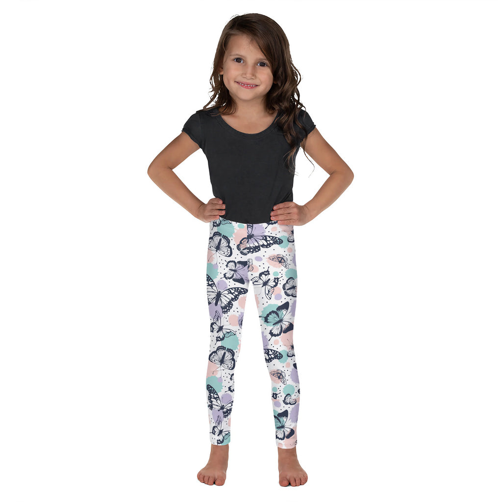 A child wearing girls butterfly buttery soft leggings with pastel butterfly pattern and black outlines