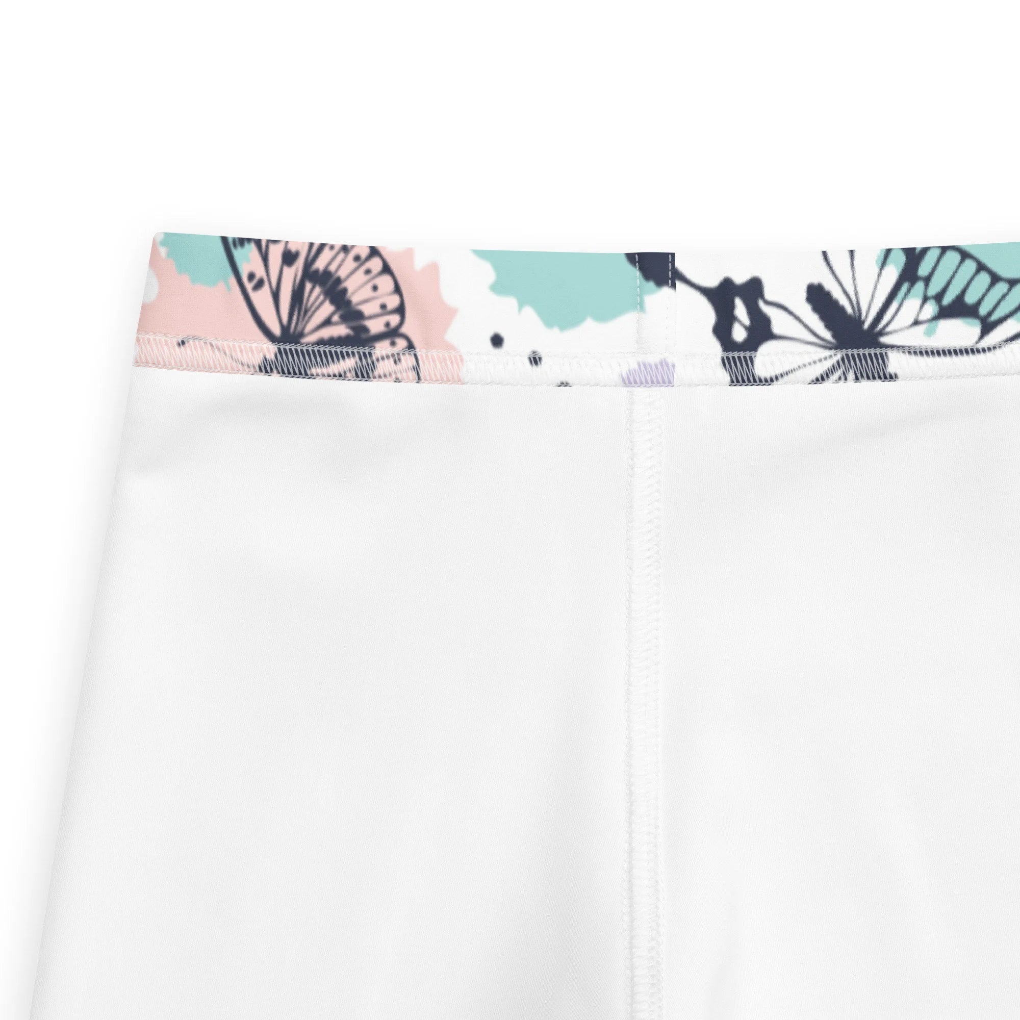 White girls butterfly buttery soft leggings with decorative waistband featuring black butterfly prints on pink teal background