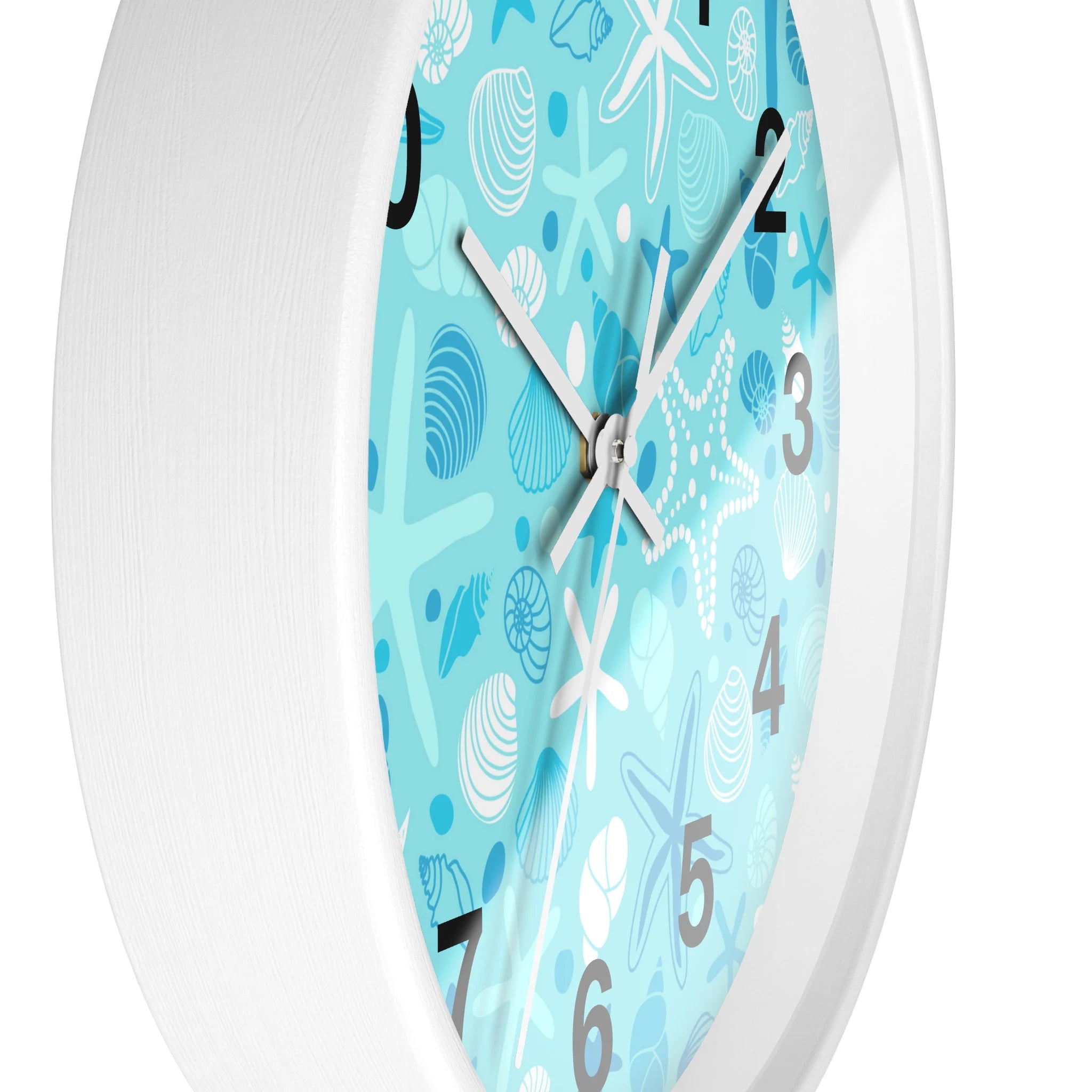 Kids ocean shells silent wood wall clock with white frame and light blue face featuring seashell and sea creature patterns