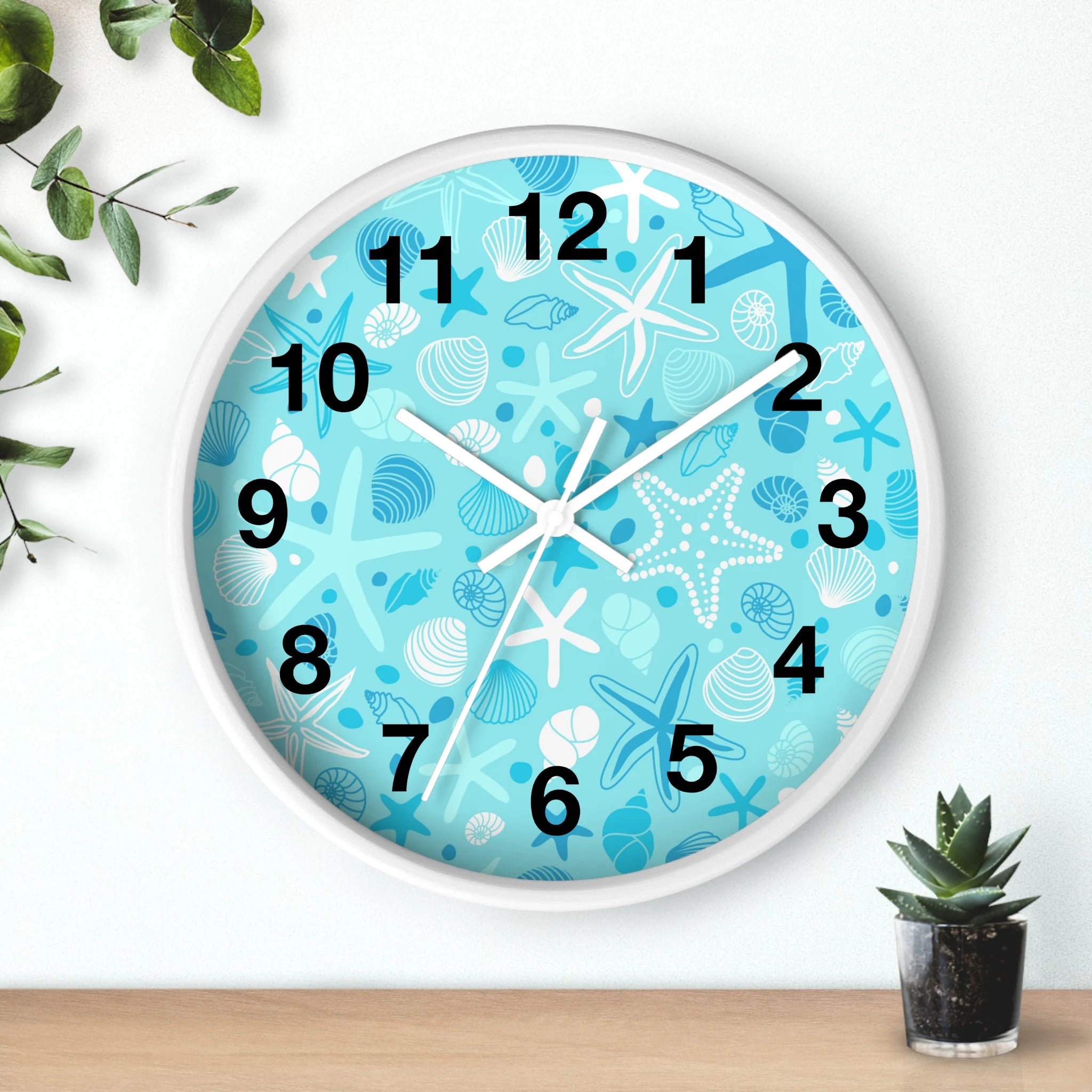 Kids ocean shells silent wood wall clock with light blue face featuring white and blue starfish and seashell patterns