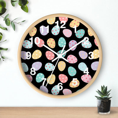Easter eggs silent wood wall clock with light wood frame black face and colorful pastel Easter egg design