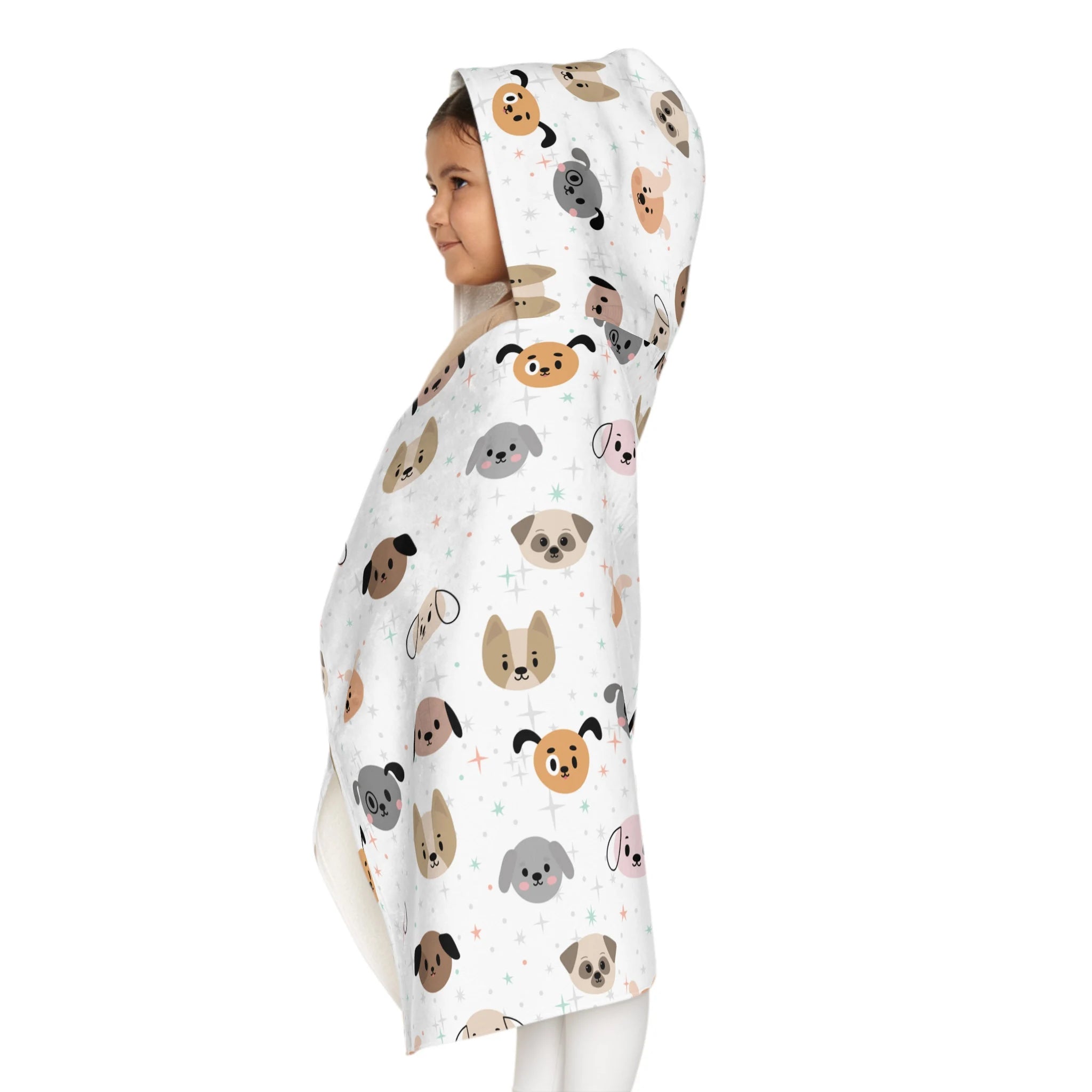 White hooded kids towel with soft absorbent fabric featuring colorful cartoon dogs for bath and beach use