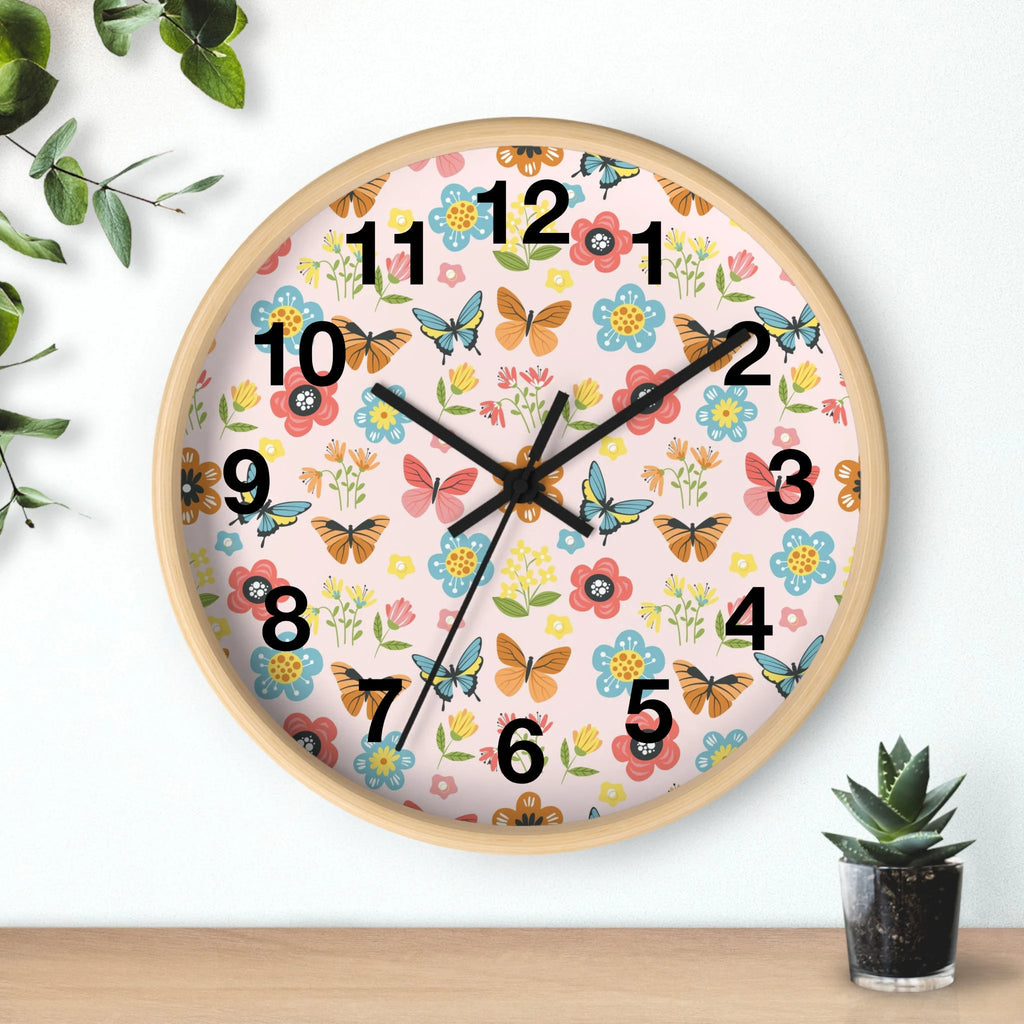 Kids butterfly garden silent wood wall clock with a light wood frame and pink face featuring floral and butterfly patterns