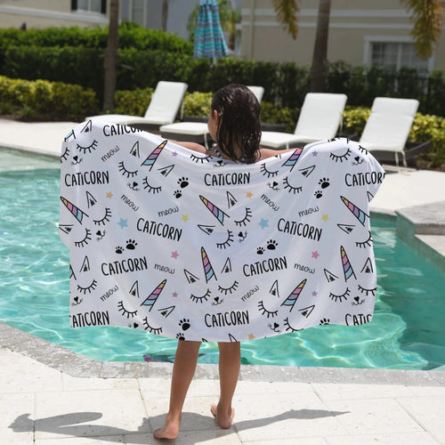 Girls caticorn towel featuring white soft fabric with colorful unicorn horns black text and paw prints design