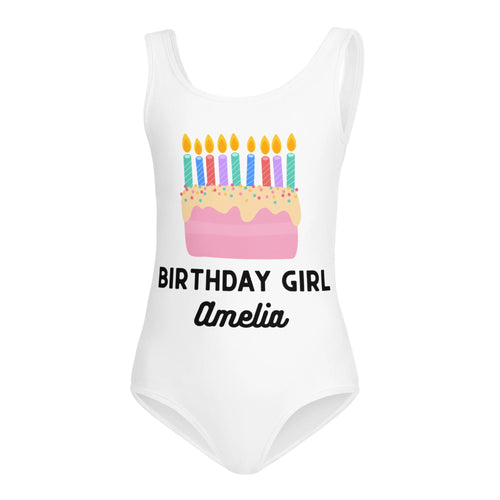 White one-piece girls leotard with colorful birthday cake graphic and birthday girl amelia text for dance and gymnastics