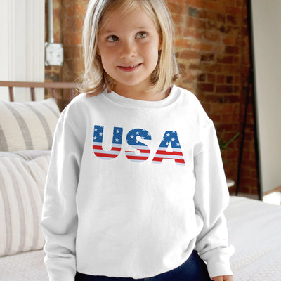 White long-sleeved kids usa sweatshirt with red white and blue flag design printed across the chest