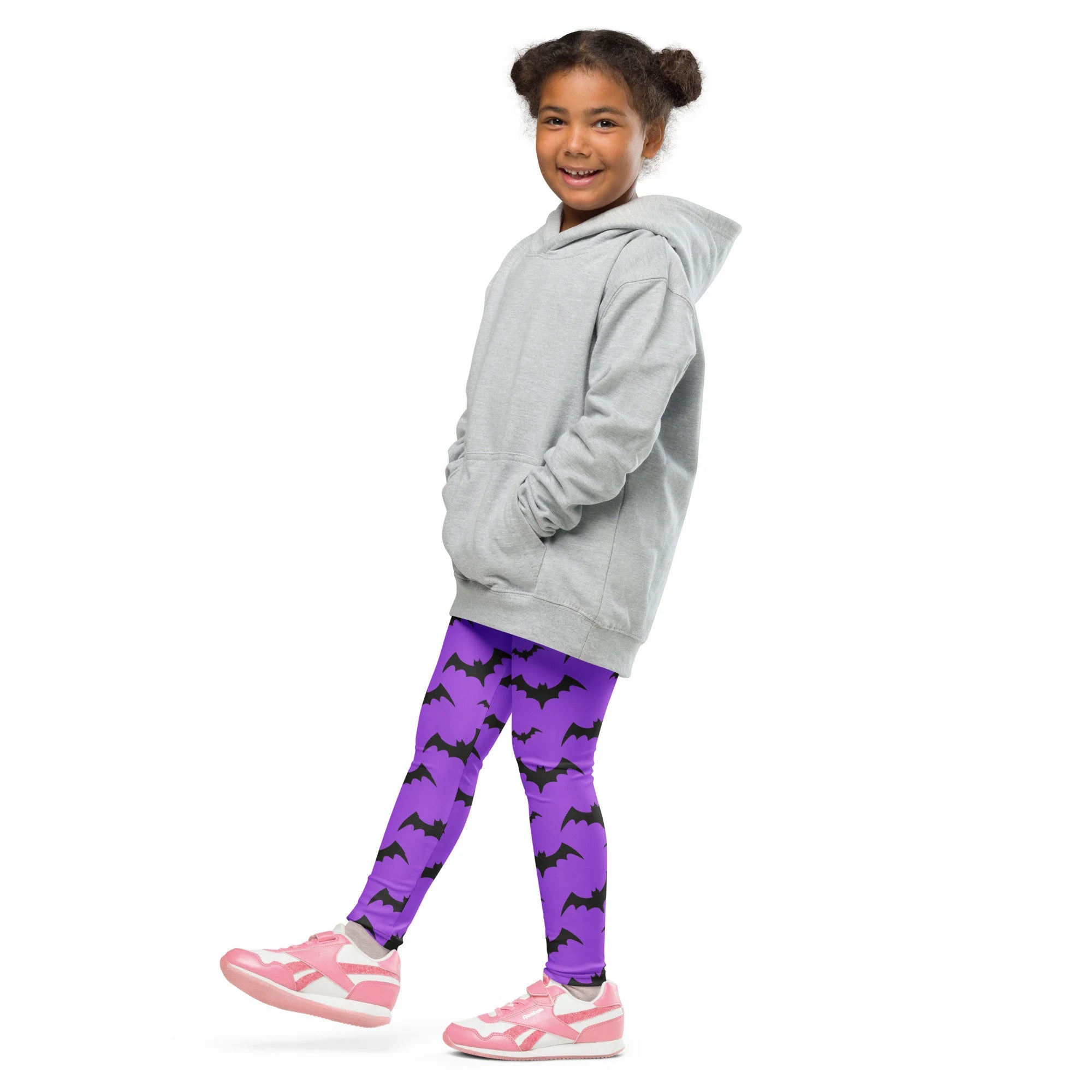 Gray hooded sweatshirt with front pockets and relaxed fit shown with kids purple bats halloween buttery soft leggings