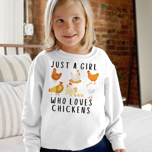 White long-sleeved girls sweatshirt with playful chicken graphic and just a girl who loves chickens text in black