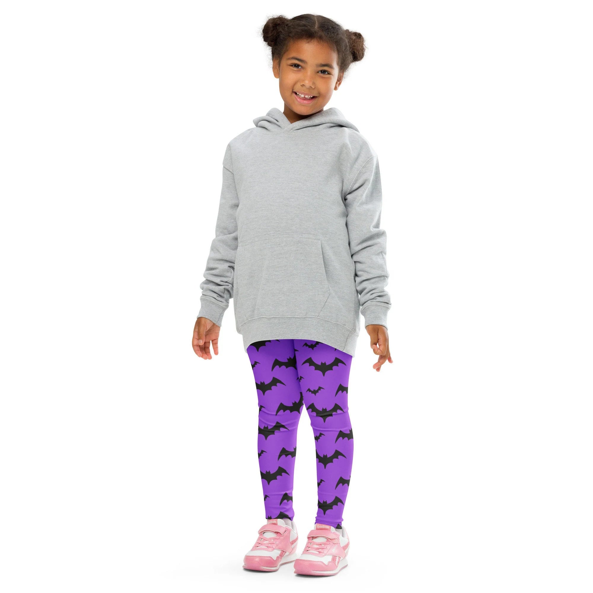 Gray hooded sweatshirt with front pocket and long sleeves shown with kids purple bats halloween buttery soft leggings