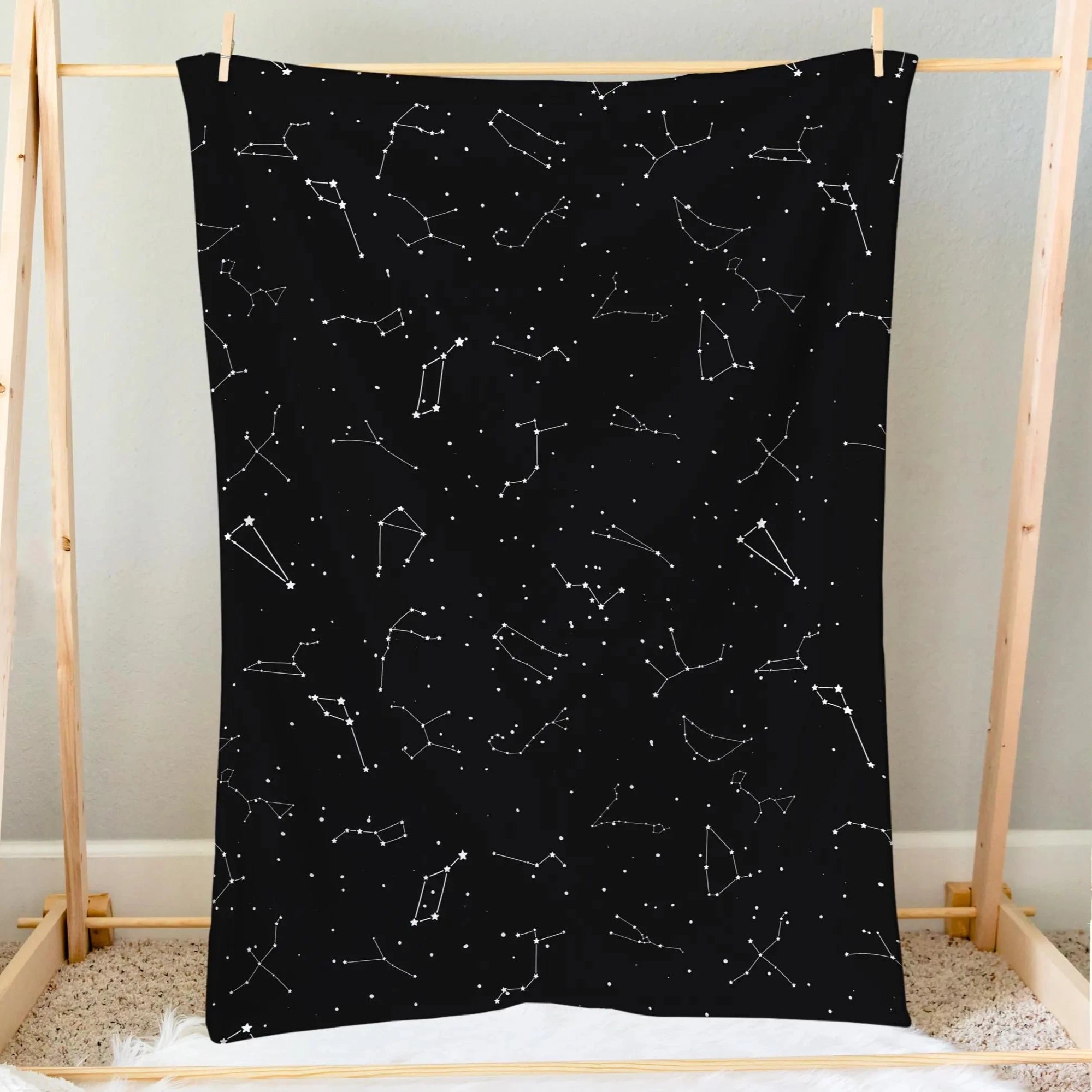 Kids realistic constellation space blanket featuring a soft black fabric with a white constellation pattern for galaxy-themed adventures