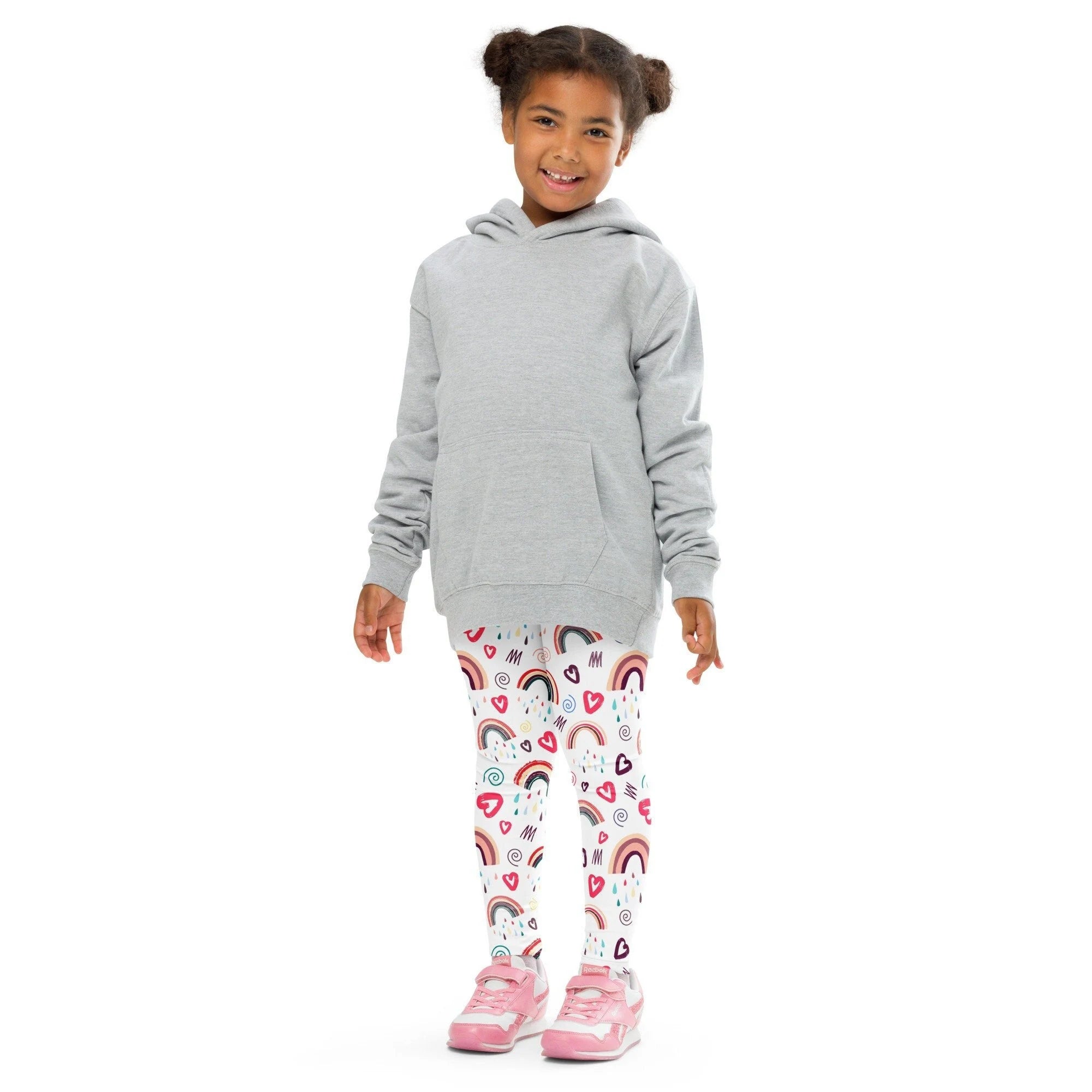 Gray hooded sweatshirt with front pocket and long sleeves paired with girls rainbow doodle heart buttery soft leggings