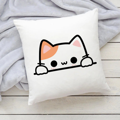 White square pillow with a cute kawaii cartoon cat peeking over the edge with orange and pink accents