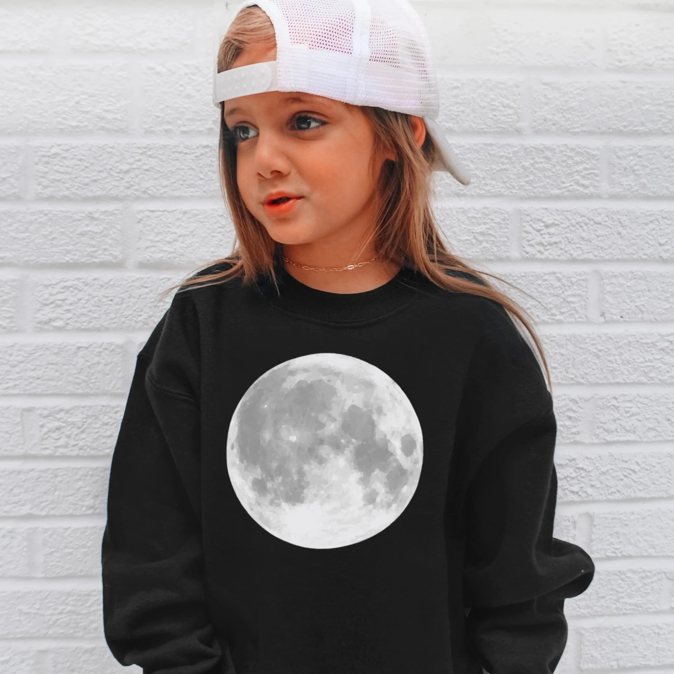 Black kids sweatshirt with detailed grayscale full moon print centered on the chest for casual wear