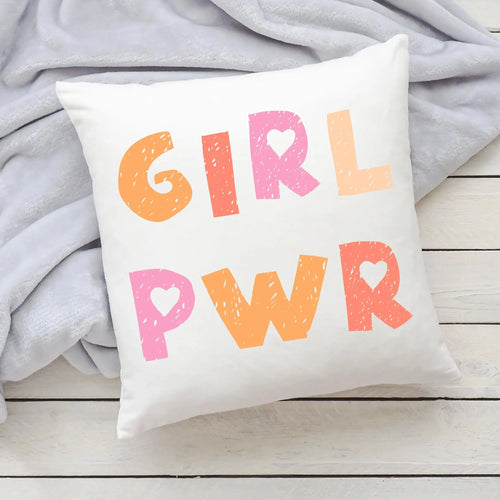 White throw pillow with girl pwr printed in colorful textured orange and pink letters with heart shapes inside the rs