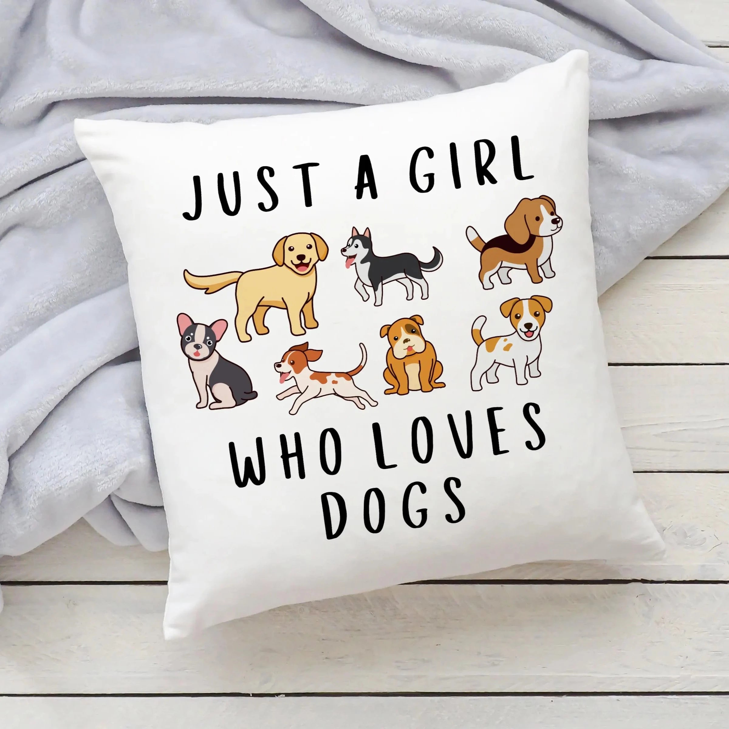White throw pillow with playful cartoon dog breeds and black text just a girl who loves dogs for girls bedroom decor