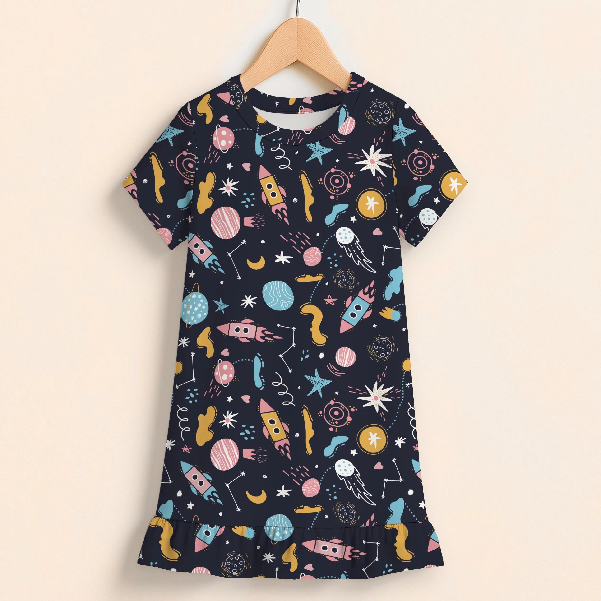 Girls outer space short sleeve ruffle hem dress in navy blue with pastel rockets planets stars and moons pattern