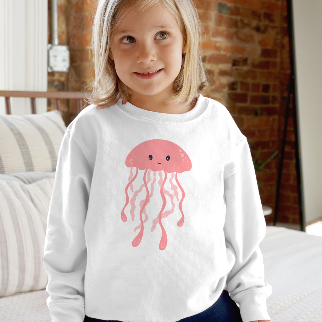White long-sleeved kids sweatshirt with pink cartoon jellyfish graphic featuring soft cotton material