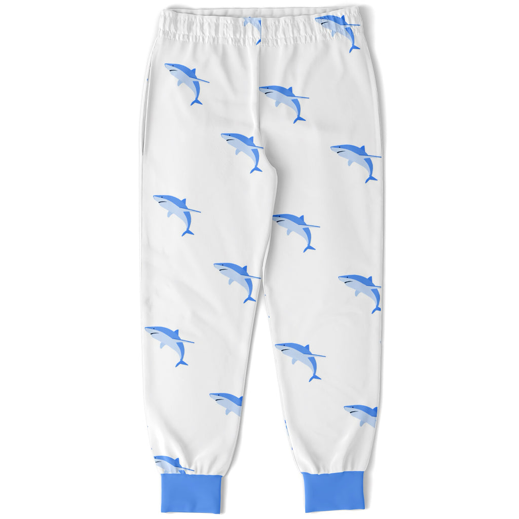Kids shark jogger pants in white cotton with blue shark pattern and solid blue cuffs for comfortable play