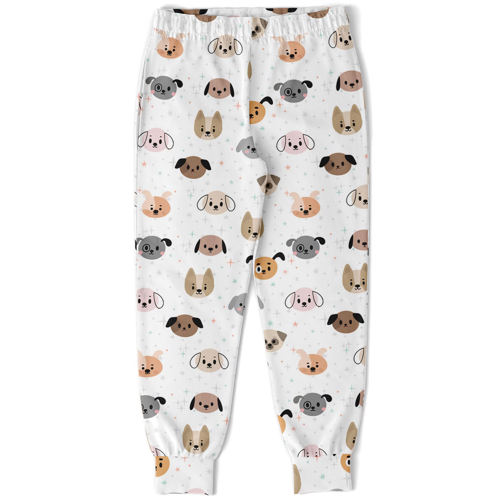 White kids jogger pants with playful multicolor cartoon dog faces printed on soft fabric for everyday wear