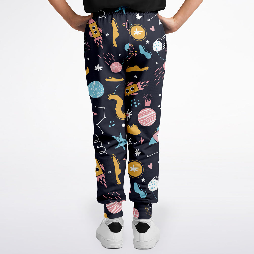 Kids outer space jogger pants in dark blue with playful pastel rockets planets stars and moons pattern